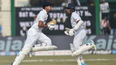 Indian players Shreyas Iyer and Wriddhiman Saha run between the wickets during fourth day of the first cricket test match between India and New Zealand, at Green Park stadium in Kanpur, Sunday, Nov. 28, 2021. (PTI) Indian players Shreyas Iyer and Wriddhiman Saha run between the wickets during fourth day of the first cricket test match between India and New Zealand, at Green Park stadium in Kanpur, Sunday, Nov. 28, 2021. (PTI)