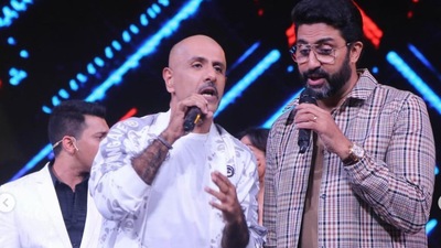 Vishal Dadlani and Abhishek Bachchan singing a song together. 