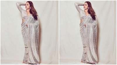 Huma paired the saree with a plunging V neckline blouse decorated with matching ivory sequins. It had long sleeves, cut-outs on the shoulder, and a cropped length that flaunted her curves. (Instagram/@iamhumaq) Huma paired the saree with a plunging V neckline blouse decorated with matching ivory sequins. It had long sleeves, cut-outs on the shoulder, and a cropped length that flaunted her curves. (Instagram/@iamhumaq)