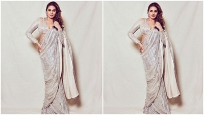 The georgette six yards came adorned with shimmery ivory sequins placed in vertical lines all over the drape. The golden sequin borders all over added a pleasant contrast to Huma neo-ethnic look. The actor wore the elegant number in a traditional style. (Instagram/@iamhumaq) The georgette six yards came adorned with shimmery ivory sequins placed in vertical lines all over the drape. The golden sequin borders all over added a pleasant contrast to Huma neo-ethnic look. The actor wore the elegant number in a traditional style. (Instagram/@iamhumaq)