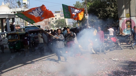 BJP supporters burn firecrackers outside a counting centre during the Tripura Municipal Corporation Election in Agartala on Sunday. (ANI)