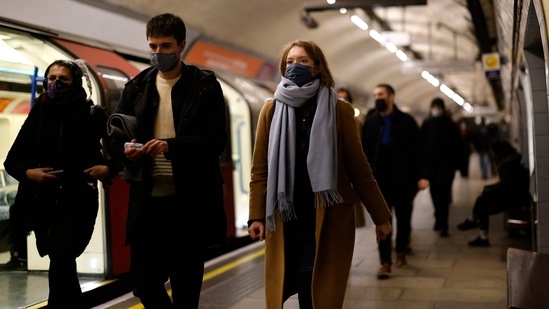 Passengers, many wearing face coverings to combat the spread of Covid-19, walk along a platform as they travel on the London underground in central London.(AFP) Passengers, many wearing face coverings to combat the spread of Covid-19, walk along a platform as they travel on the London underground in central London.(AFP)