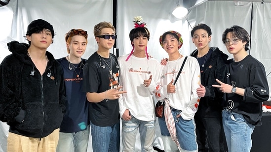 (L-R) BTS members V, Suga, RM, Jin, J-Hope, Jungkook and Jimin pose together for a picture after Permission to Dance on Stage LA day 1 came to an end.&nbsp;(Big Hit Ent/Twitter)