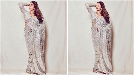 Huma paired the saree with a plunging V neckline blouse decorated with matching ivory sequins. It had long sleeves, cut-outs on the shoulder, and a cropped length that flaunted her curves.(Instagram/@iamhumaq)