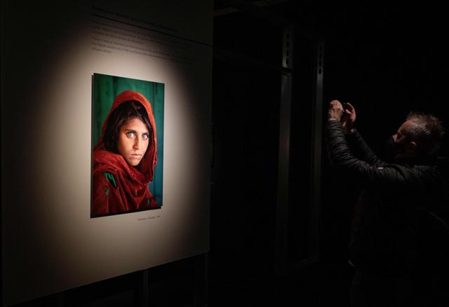 She’s probably the best recognised Afghan woman ever; the girl with the startling green eyes on National Geographic’s cover in 1984 (AFP)