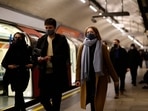 Passengers, many wearing face coverings to combat the spread of Covid-19, walk along a platform as they travel on the London underground in central London. Passengers, many wearing face coverings to combat the spread of Covid-19, walk along a platform as they travel on the London underground in central London.