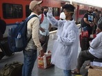 A health worker collects swab samples of passengers at Mumbai railway station.(Bhushan Koyande/HT Photo) A health worker collects swab samples of passengers at Mumbai railway station.(Bhushan Koyande/HT Photo)