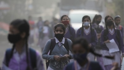 School girls walk towards a school as they reopened after remaining closed for nearly 15 days due to a spike in air pollution, on a smoggy morning in New Delhi (Reuters) School girls walk towards a school as they reopened after remaining closed for nearly 15 days due to a spike in air pollution, on a smoggy morning in New Delhi (Reuters)
