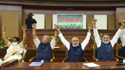 Bihar Chief Minister Nitish Kumar with other ministers raises hands in favour of prohibition on liquor in the state, during the NDA Legislature Party meeting, in Patna on Monday. (PTI) Bihar Chief Minister Nitish Kumar with other ministers raises hands in favour of prohibition on liquor in the state, during the NDA Legislature Party meeting, in Patna on Monday. (PTI)