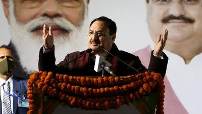 Murugan's photo came up on posters put up by the BJP for its slum outreach campaign, which was addressed by party president JP Nadda on Monday. (ANI) Murugan's photo came up on posters put up by the BJP for its slum outreach campaign, which was addressed by party president JP Nadda on Monday. (ANI)