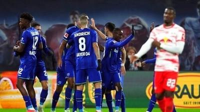 Leverkusen's Moussa Diaby, 2nd right, celebrates scoring his side's second goal, during the German Bundesliga soccer match between RB Leipzig and Bayer Leverkusen, at the Red Bull Arena in Leipzig, Germany, Sunday, Nov. 28, 2021. (Jan Woitas/dpa via AP) (AP) Leverkusen's Moussa Diaby, 2nd right, celebrates scoring his side's second goal, during the German Bundesliga soccer match between RB Leipzig and Bayer Leverkusen, at the Red Bull Arena in Leipzig, Germany, Sunday, Nov. 28, 2021. (Jan Woitas/dpa via AP) (AP)