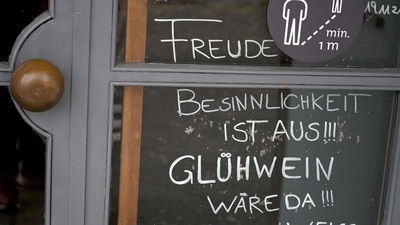 The lettering on a board in the window of a bar reads 'Happiness and contemplativeness are out of stock, but we have mulled wine - red or white' in Salzburg, Austria, (Barbara Gindl/ APA / AFP/ Austria OUT) The lettering on a board in the window of a bar reads 'Happiness and contemplativeness are out of stock, but we have mulled wine - red or white' in Salzburg, Austria, (Barbara Gindl/ APA / AFP/ Austria OUT)
