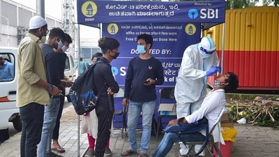 Covid test of passengers at KSRTC bus stand in Bengaluru. (PTI) Covid test of passengers at KSRTC bus stand in Bengaluru. (PTI)
