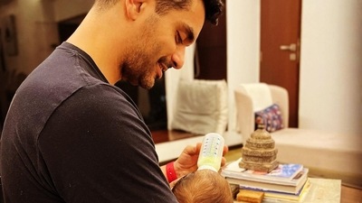 Angad Bedi feeds his one-month-old son. Angad Bedi feeds his one-month-old son. 