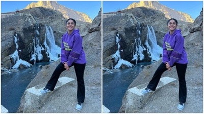 Mrunal posed on a rock of sorts, with a picturesque backdrop of a flowing stream and snow. (Instagram/@mrunalthakur)