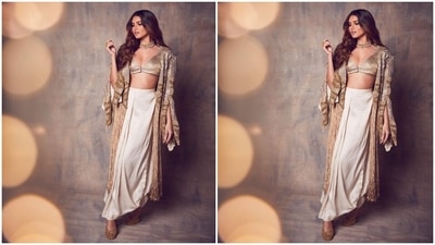 Tara's ensemble for the occasion features a sleeveless gold blouse in silk satin fabric. The bralette-style top comes with a plunging V neckline, broad straps to hold it in place, front button closures, and a cropped length baring the star's toned midriff. (Instagram/@tarasutaria) Tara's ensemble for the occasion features a sleeveless gold blouse in silk satin fabric. The bralette-style top comes with a plunging V neckline, broad straps to hold it in place, front button closures, and a cropped length baring the star's toned midriff. (Instagram/@tarasutaria)
