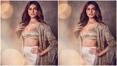 Tara paired the shimmery bralette with a high waist asymmetric skirt in an ethereal white shade. The structure of the pleated bottom with its flowy silhouette and quirky hemline paid ode to the designer's signature eclectic style. (Instagram/@tarasutaria) Tara paired the shimmery bralette with a high waist asymmetric skirt in an ethereal white shade. The structure of the pleated bottom with its flowy silhouette and quirky hemline paid ode to the designer's signature eclectic style. (Instagram/@tarasutaria)