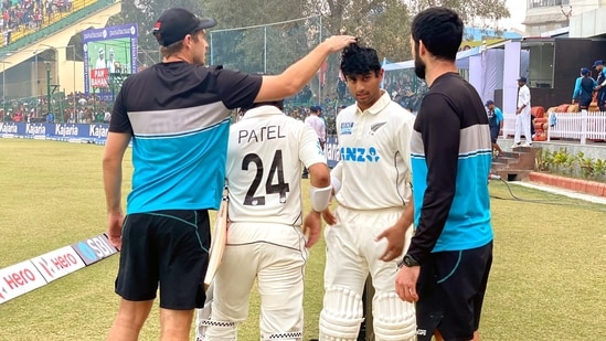 New Zealand's Ajaz Patel and Rachin Ravindra being congratulated by their teammates after the end of play on Day-5 of the 1st Test match between India and New Zealand, at Green Park International Stadium, in Kanpur on Monday(ANI)