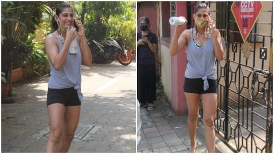 Kubbra wore the tank top with fitted black cycling shorts completing her yoga session look. She wrapped it up with a printed face mask attached with a chunky chain, flip flops, sleeked back bun and bare face.
