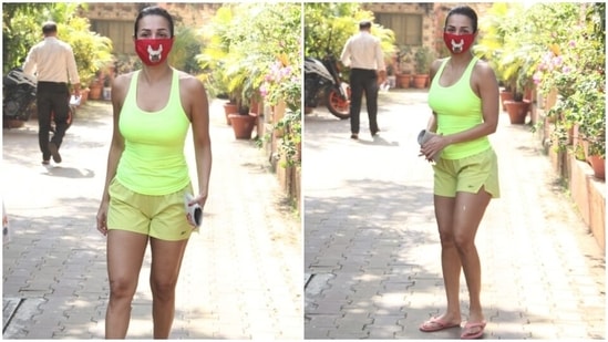 Malaika wore a neon green tank top with scooped U neckline, racerback detail and a figure-skimming fit to the gym today. She teamed the top with a pair of matching training shorts and flaunted her long legs in it.