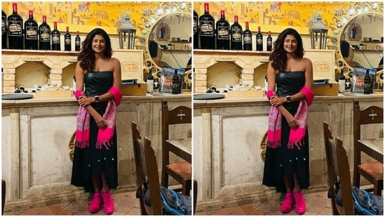 Pooja accessorised her look with a bright pink throw and pink sneakers.(Instagram/@poojabatra)