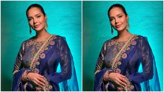 Esha teamed a bright blue embellished kurta with an orange and pink long skirt. The full-sleeved kurta was embellished in silver resham threads, while the contrasting long skirt was adorned in silver zari and moti.(Instagram/@egupta)