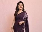 In a  <span class='webrupee'>₹</span>76K wine floral saree, Madhuri Dixit blends elegance and grace