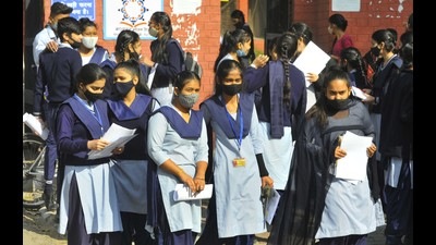 Students coming out of Government Senior Secondary School in Sector 33, Chandigarh, after the CBSE Class-10 first-term exam was held on Tuesday amid strict Covid protocol. (Keshav Singh/HT)