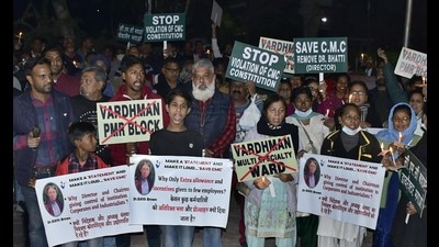 A candle light march and protest being held to oppose the naming of CMCH’s cardiology centre after an industrialist near Kalvary Church in Ludhiana on Tuesday. (Harsimar Pal Singh/HT) A candle light march and protest being held to oppose the naming of CMCH’s cardiology centre after an industrialist near Kalvary Church in Ludhiana on Tuesday. (Harsimar Pal Singh/HT)