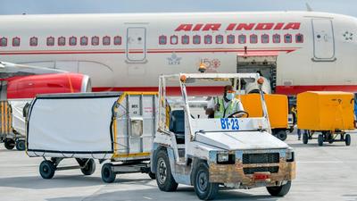 An Air India flight carrying doses of the Covishield vaccine manufactured in India is seen after its arrival at the Velana International Airport (AFP)