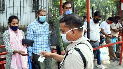 As per Maharashtra government guidelines, a conductor checks the double dose Covid vaccine certificate before giving a bus ticket to passengers, in Mumbai. (ANI) As per Maharashtra government guidelines, a conductor checks the double dose Covid vaccine certificate before giving a bus ticket to passengers, in Mumbai. (ANI)