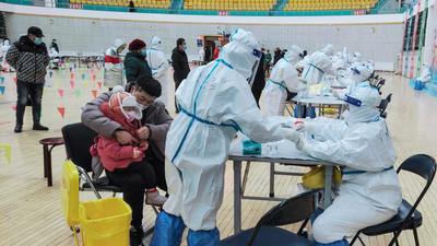 Residents being given nucleic acid tests for the Covid-19 coronavirus in Manzhouli in China's northern Inner Mongolia region. (AFP) Residents being given nucleic acid tests for the Covid-19 coronavirus in Manzhouli in China's northern Inner Mongolia region. (AFP)