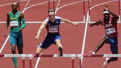 Norway's Karsten Warholm (C) USA's Rai Benjamin (2R) and Brazil's Alison Dos Santos (L) compete in the men's 400m hurdles final during the Tokyo 2020 Olympic Games (AFP/File Photo) Norway's Karsten Warholm (C) USA's Rai Benjamin (2R) and Brazil's Alison Dos Santos (L) compete in the men's 400m hurdles final during the Tokyo 2020 Olympic Games (AFP/File Photo)