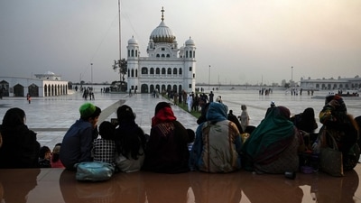 Covering one’s head in a gurdwara is mandatory and considered as a way of showing respect for the revered place. See here is a group of devotees at Kartarpur Gurdwara. (AFP File Photo) Covering one’s head in a gurdwara is mandatory and considered as a way of showing respect for the revered place. See here is a group of devotees at Kartarpur Gurdwara. (AFP File Photo)
