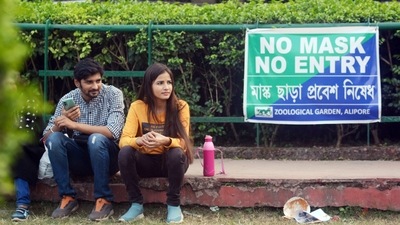 Visitors sit without wearing masks inside Alipore zoo amid the scare of new coronavirus variant, in Kolkata on Monday. (ANI) Visitors sit without wearing masks inside Alipore zoo amid the scare of new coronavirus variant, in Kolkata on Monday. (ANI)
