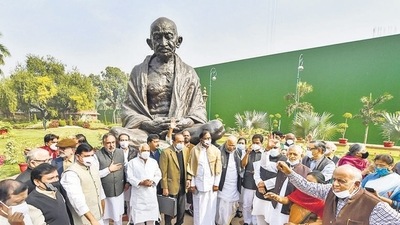Opposition leaders protest near Mahatma Gandhi's statue over suspension of 12 Rajya Sabha MPs during the Winter Session of Parliament, in New Delhi, on Tuesday. (PTI) Opposition leaders protest near Mahatma Gandhi's statue over suspension of 12 Rajya Sabha MPs during the Winter Session of Parliament, in New Delhi, on Tuesday. (PTI)