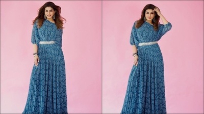 Leaving her luscious tresses open down her shoulders in mid-parted hairstyle, Raveena accessorised her look with a pair of silver dangler earrings, a stack of funky bracelets from and finger rings from Abhilasha Pret Jewellery and Silverstreak. (Instagram/officialraveenatandon)