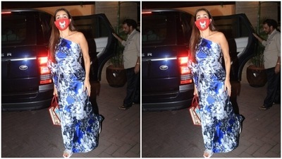 All masked up, Malaika posed for the cameras before getting in her car. (HT Photos/Varinder Chawla)