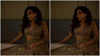The midriff-baring sleeveless blouse, worn by Karishma, was intricately embroidered in golden resham threads. (Instagram/@karishmaktanna)