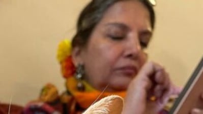 One of the pictures showed Shabana Azmi busy with her phone. 
