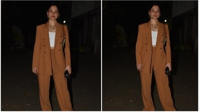 Tamannaah wore the blazer over a bodycon crop top in white shade, which hinted at her toned midriff. A pair of high-waisted pants with wide legs and a floor-grazing hem rounded off the ensemble. (HT Photo/Varinder Chawla) Tamannaah wore the blazer over a bodycon crop top in white shade, which hinted at her toned midriff. A pair of high-waisted pants with wide legs and a floor-grazing hem rounded off the ensemble. (HT Photo/Varinder Chawla)