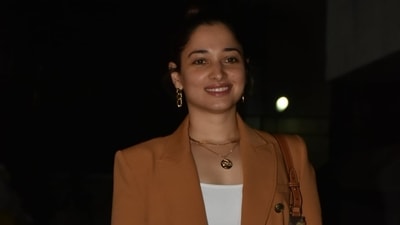 Tamannaah tied her tresses in a sleek top knot to keep things fuss-free and elegant. Her glam picks include a glossy pink lip shade, glowing skin, and mascara-laden lashes. What do you think about this look? (HT Photo/Varinder Chawla) Tamannaah tied her tresses in a sleek top knot to keep things fuss-free and elegant. Her glam picks include a glossy pink lip shade, glowing skin, and mascara-laden lashes. What do you think about this look? (HT Photo/Varinder Chawla)
