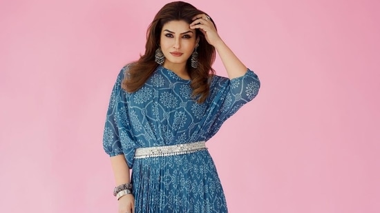If you are searching for fashion cues to look apart and make a sartorial statement on a cocktail evening, Bollywood diva Raveena Tandon got you sorted with her Indo-western style in a gathered pleated gown.(Instagram/officialraveenatandon)