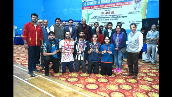 Prize-winning shuttlers pose for a photograph on the concluding day of the 54th Yonex Sunrise Haryana Senior State Badminton championship in Panchkula on Tuesday. (HT Photo)