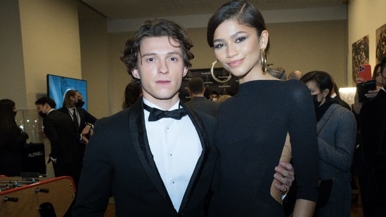 Tom Holland wraps his arm around Zendaya as they attend Ballon d’Or ...