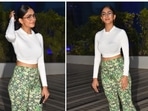 Mrunal Thakur was earlier spotted at producer Murad Khetani’s office in Andheri West donning a white full-sleeve crop top and green floral printed flared pants.(HT Photo/Varinder Chawla) Mrunal Thakur was earlier spotted at producer Murad Khetani’s office in Andheri West donning a white full-sleeve crop top and green floral printed flared pants.(HT Photo/Varinder Chawla)