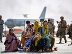 (FILES) Evacuee children wait for the next flight after being manifested at Hamid Karzai International Airport, Kabul.(AFP PHOTO / Mark Andries / US MARINE CORPS) (FILES) Evacuee children wait for the next flight after being manifested at Hamid Karzai International Airport, Kabul.(AFP PHOTO / Mark Andries / US MARINE CORPS)