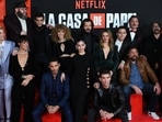 Casa de Papel cast members pose for a family picture during a photocall for the presentation of the last part of the fifth season of the Spanish TV show Money Heist (La Casa de Papel) at the Palacio Vistalegre arena in Madrid.(AFP)