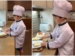 Yash Johar making sandwiches in the kitchen. Yash Johar making sandwiches in the kitchen.