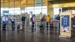 Passengers lined up at a terminal at the Chhatrapati Shivaji Maharaj International Airport, in Mumbai on Wednesday. (PTI) Passengers lined up at a terminal at the Chhatrapati Shivaji Maharaj International Airport, in Mumbai on Wednesday. (PTI)